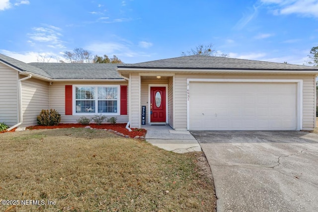 ranch-style home with a garage and a front yard