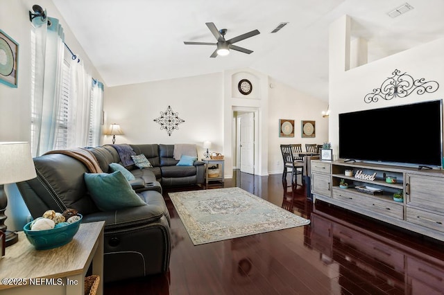 living room with lofted ceiling, dark hardwood / wood-style floors, and ceiling fan