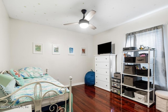 bedroom with ceiling fan and dark hardwood / wood-style floors