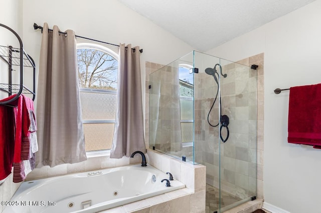 bathroom with plus walk in shower and a textured ceiling