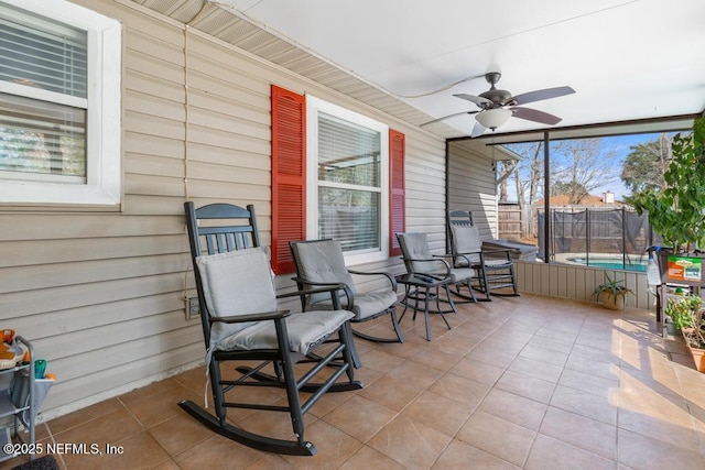 sunroom with ceiling fan