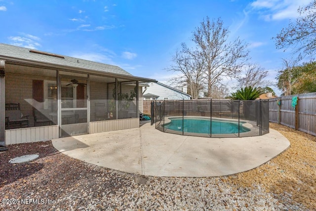 view of pool featuring a sunroom and a patio area