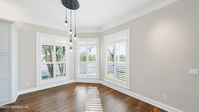 unfurnished dining area featuring ornamental molding, dark hardwood / wood-style floors, and a wealth of natural light