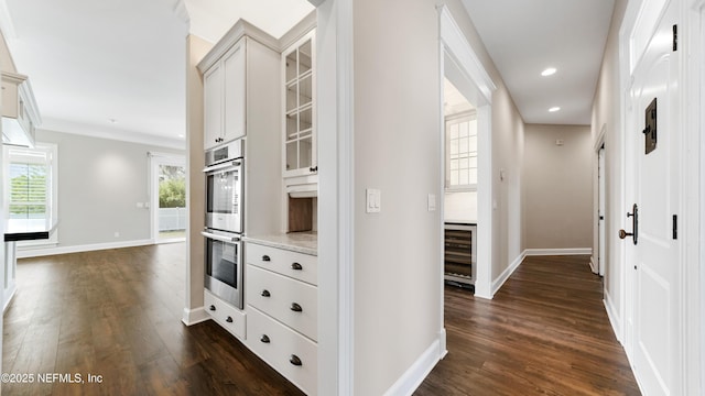 hall featuring beverage cooler and dark hardwood / wood-style flooring