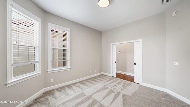 view of carpeted spare room