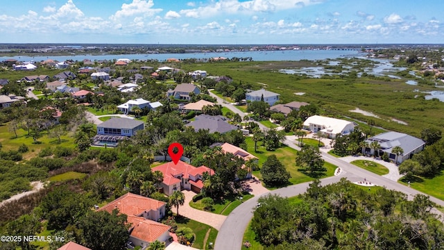 drone / aerial view with a water view