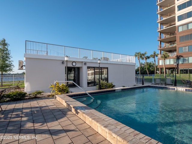 view of swimming pool with a patio