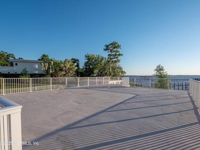 wooden deck with a water view