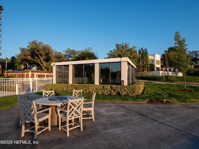 view of patio / terrace with a sunroom