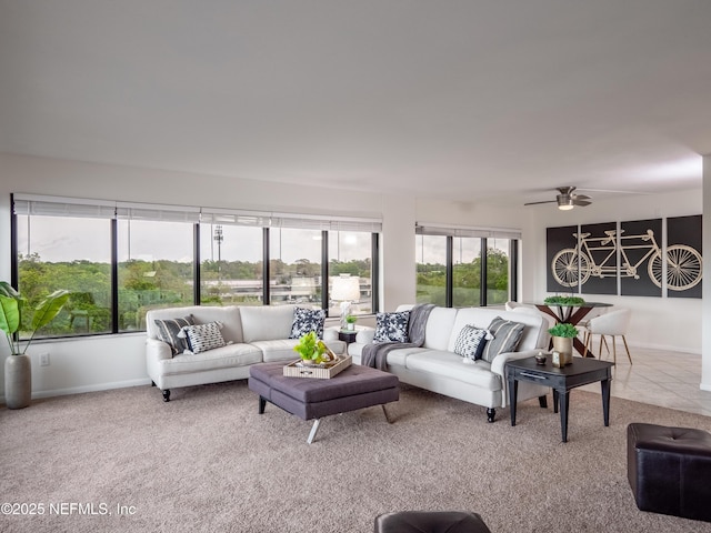 carpeted living room featuring ceiling fan