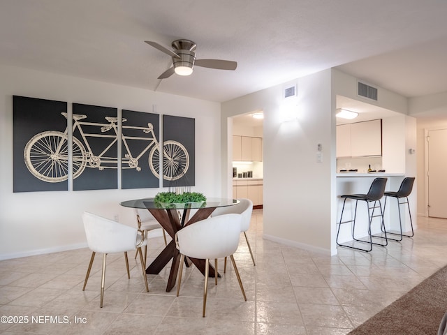 dining room with ceiling fan