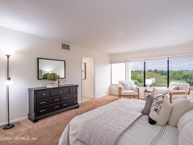 bedroom featuring light colored carpet