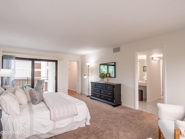 bedroom with light carpet, access to exterior, and ensuite bathroom