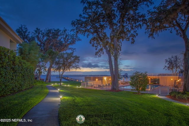 yard at dusk with a water view