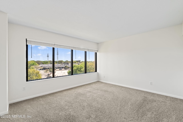 6000 San Jose Blvd Unit 6F, Jacksonville, FL 32217 - empty room featuring carpet and baseboards