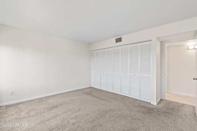 6000 San Jose Blvd Unit 6F, Jacksonville, FL 32217 - unfurnished bedroom featuring baseboards, visible vents, a closet, and carpet floors