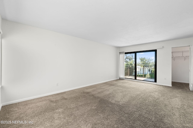 6000 San Jose Blvd Unit 6F, Jacksonville, FL 32217 - unfurnished room featuring baseboards and carpet