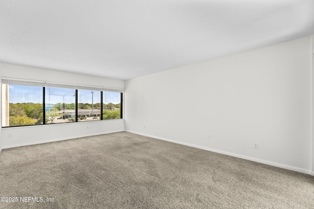 6000 San Jose Blvd Unit 6F, Jacksonville, FL 32217 - empty room with carpet and baseboards