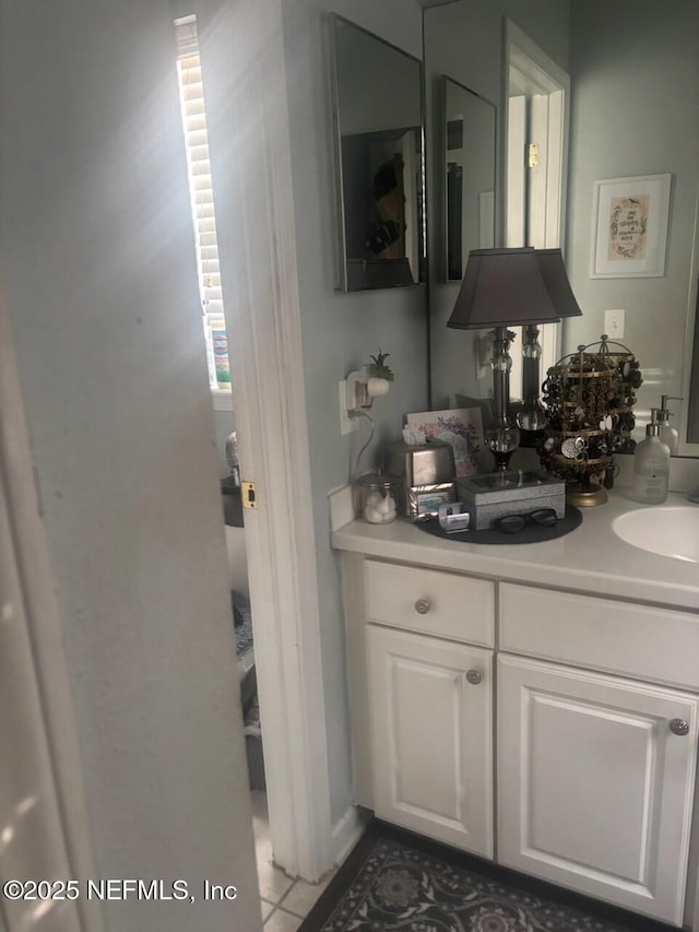 bathroom with vanity and tile patterned floors