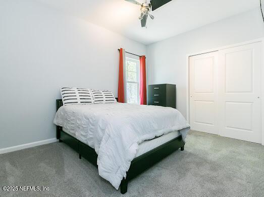 bedroom featuring a closet and ceiling fan