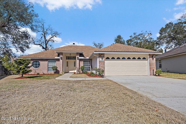 ranch-style home featuring a garage, a front yard, brick siding, and driveway