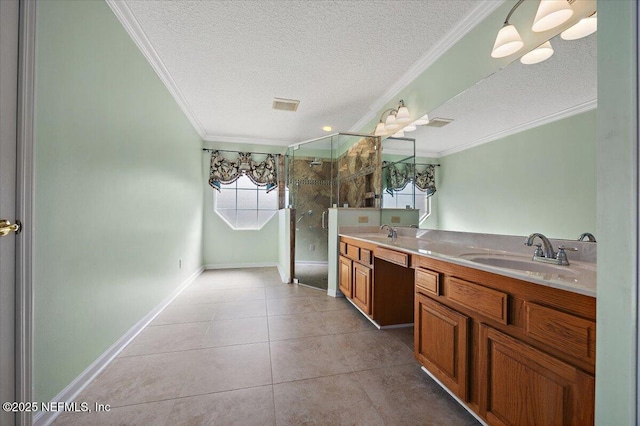 bathroom with tile patterned floors, an enclosed shower, crown molding, a textured ceiling, and vanity