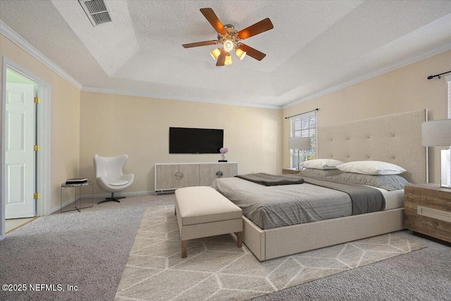 bedroom with crown molding, a textured ceiling, ceiling fan, a tray ceiling, and light colored carpet