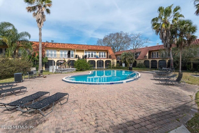 view of swimming pool with a patio