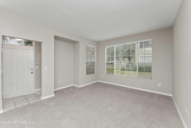 view of carpeted foyer