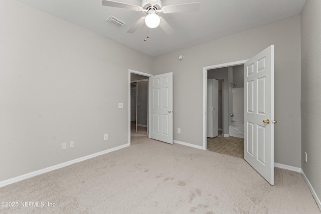 unfurnished bedroom with light colored carpet and ceiling fan