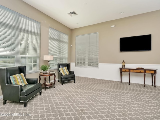 sitting room featuring carpet