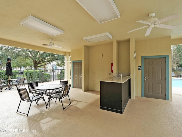 view of patio with ceiling fan