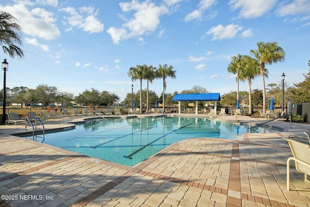 view of swimming pool featuring a patio area