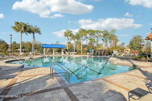 view of swimming pool with a patio