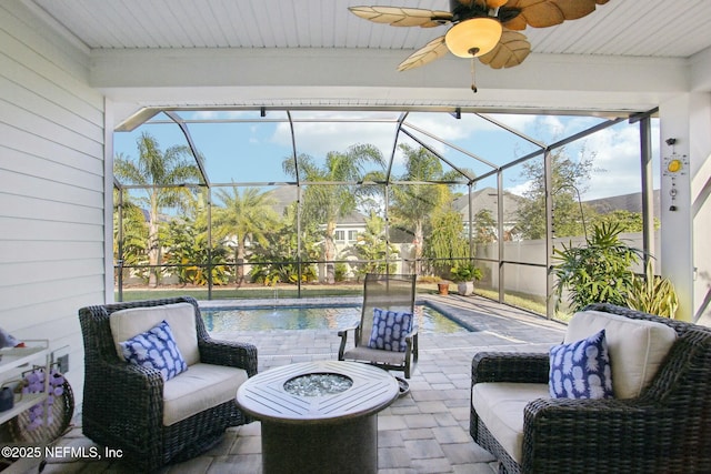 sunroom / solarium with plenty of natural light and ceiling fan