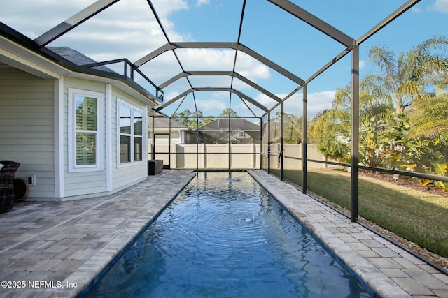 view of pool with a lanai and a patio area