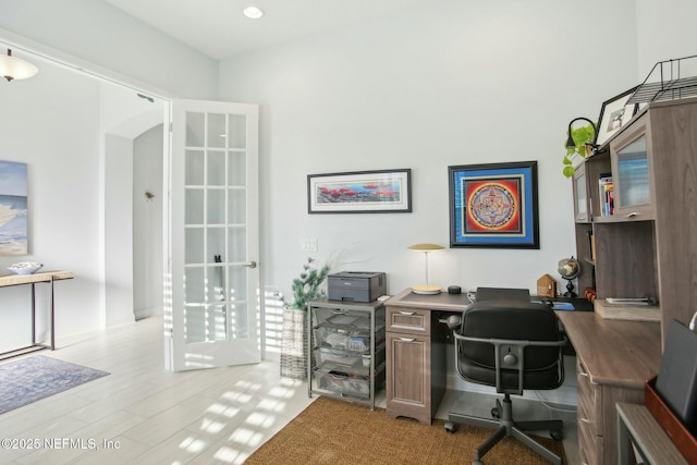 office with light hardwood / wood-style flooring