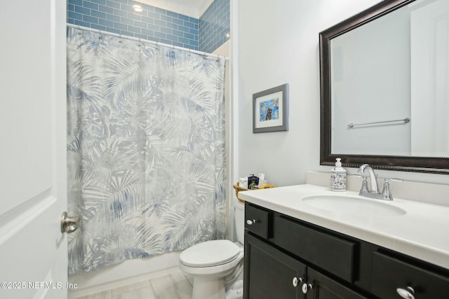 full bathroom with vanity, toilet, and shower / tub combo with curtain