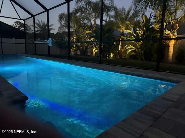 outdoor pool with glass enclosure