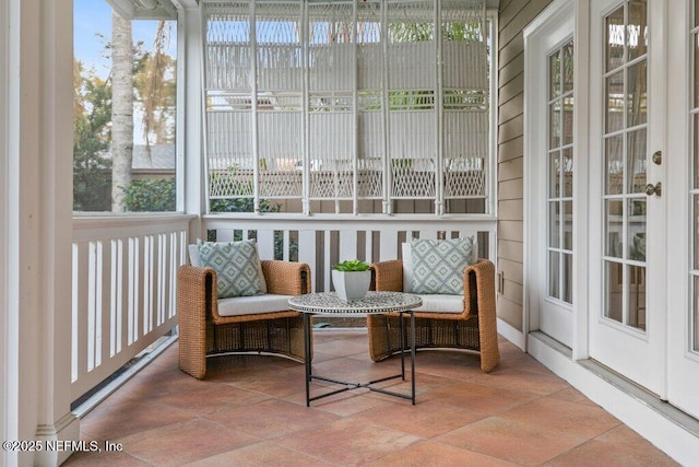 sunroom / solarium featuring plenty of natural light