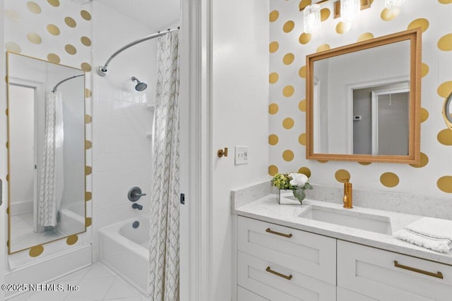 bathroom featuring vanity, tile patterned flooring, and shower / tub combo