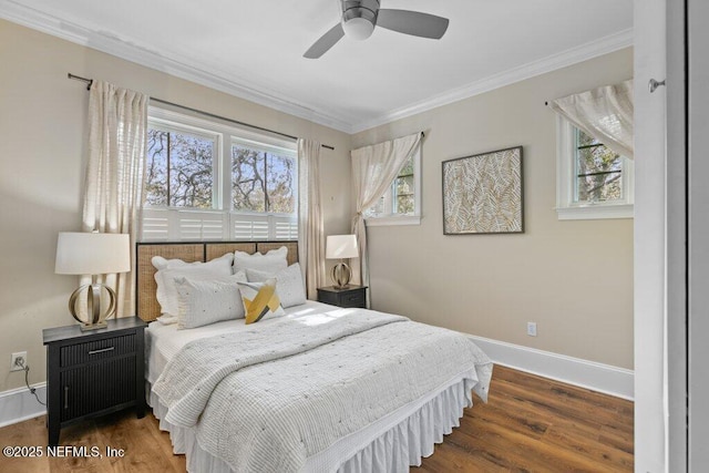 bedroom featuring crown molding, ceiling fan, and dark hardwood / wood-style flooring