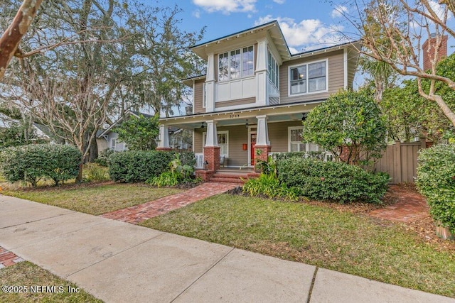 view of front of house featuring a porch and a front yard