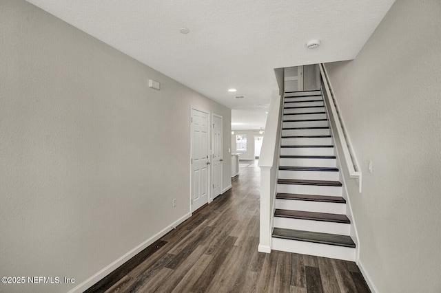 stairs featuring hardwood / wood-style flooring