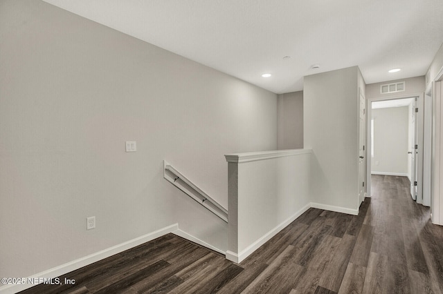 hall with dark hardwood / wood-style flooring