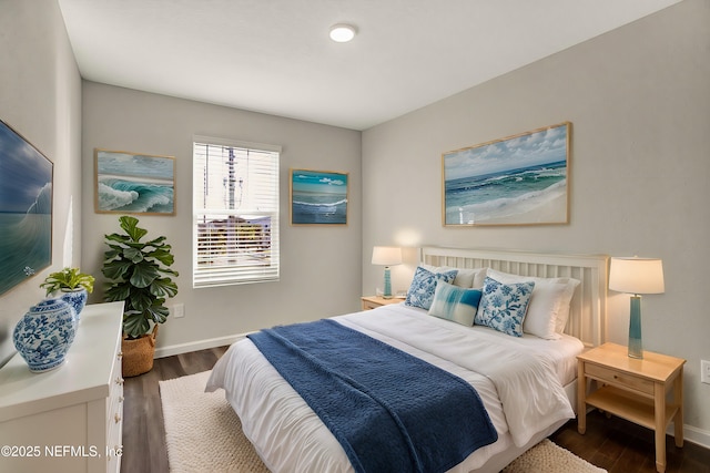 bedroom with dark hardwood / wood-style flooring