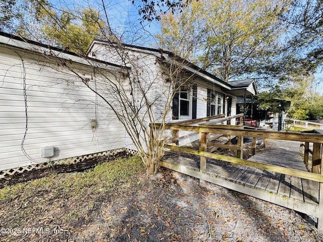 view of home's exterior with a deck