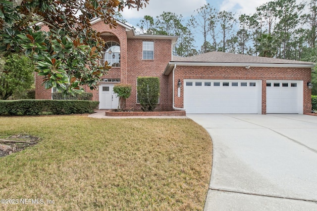 view of front of property with a garage and a front lawn