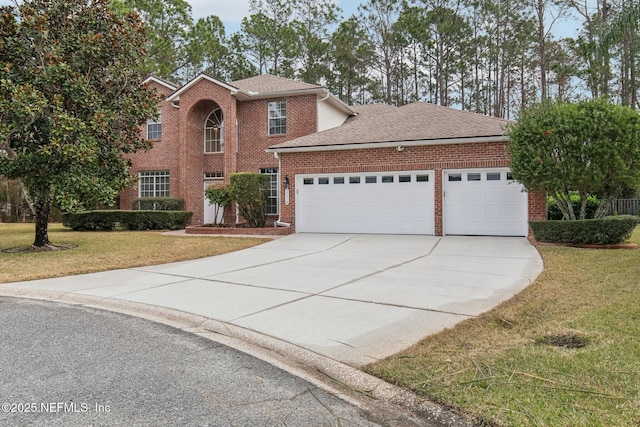 view of front facade featuring a garage and a front lawn