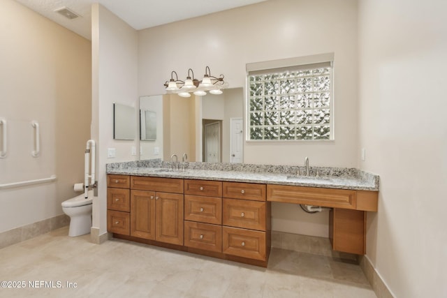 bathroom with tile patterned floors, vanity, and toilet